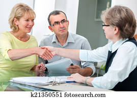 Couple talking with financial advisor