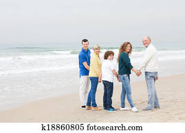 Happy family walking on beach Happy family walking on beach