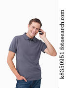 Smiling young man on his mobile phone