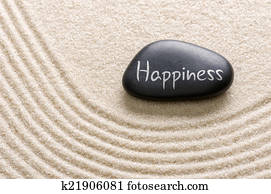 Black stone with the inscription Happiness