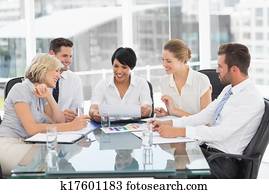 Young well dressed business people in meeting