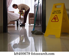 Maid at work and cleaning in luxury hotel room Maid at work and cleaning in luxury hotel room