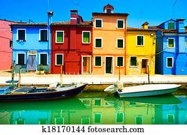 Venice landmark, Burano island canal, colorful houses and boats, Italy. Long exposure photography Venice landmark, Burano island canal, colorful houses and boats, Italy. Long exposure photography