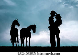 couple and horses at sunset couple and horses at sunset