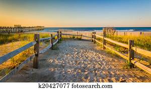 Path over sand dunes to the Atlantic Ocean at sunrise in Ventnor