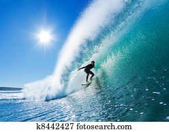 Surfer On Blue Ocean Wave