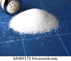 Salt shaker on wooden table