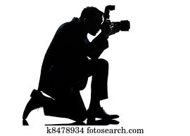 silhouette man kneeling photographer