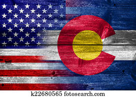USA and Colorado State Flag painted on old wood plank texture USA and Colorado State Flag painted on old wood plank texture
