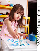 Child paint picture in preschool. Child paint picture in preschool.