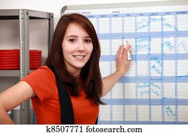 factory worker filling the schedule factory worker filling the schedule