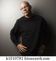 Man with hands on hips.