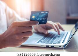 Young man use credit card for online shopping Young man use credit card for online shopping