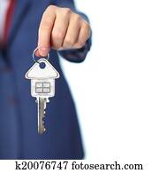 Hand with a house key. Hand with a house key.