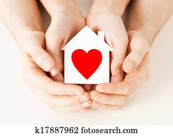 couple hands holding white paper house couple hands holding white paper house