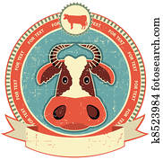 Cow head label on old paper texture. Vintage style