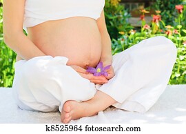 Pregnant woman in a garden