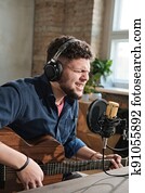 Man singing and playing guitar