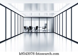 Empty meeting room behind a glass partition in modern cubicle