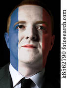 Face of serious businessman or politician painted 