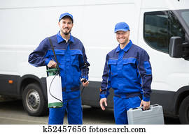 Portrait Of Two Pest Control Workers Portrait Of Two Pest Control Workers