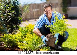 happy young man gardening happy young man gardening