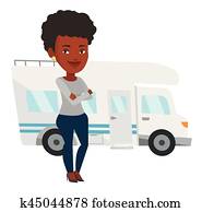 Woman standing in front of motor home.