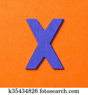 Wooden alphabet X in capital letter