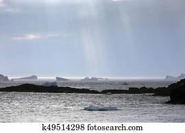 sun rays on Newfoundland icebergs