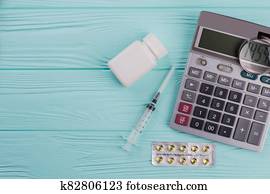 Magnifier on calculator and various medical drugs. Magnifier on calculator and various medical drugs.