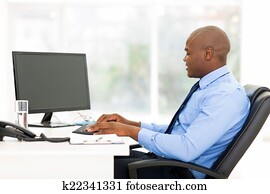 black business man typing on keyboard