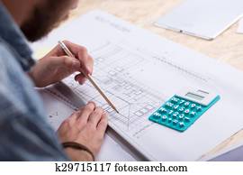 Architect estimating project cost 
