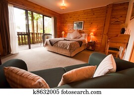 Interior of mountain wooden lodge bedroom Interior of mountain wooden lodge bedroom