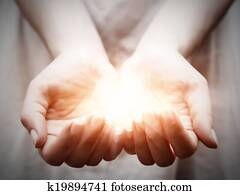 The light in young woman hands. Sharing, giving, offering, protection The light in young woman hands. Sharing, giving, offering, protection