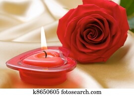 Aromatic candle and red rose 