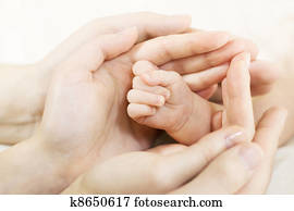 Baby hand into parents hands. Family concept Baby hand into parents hands. Family concept