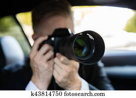 Man Photographing With SLR Camera