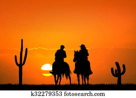 people on horseback at sunset people on horseback at sunset
