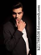 sexy provocative pose of a young fashion man