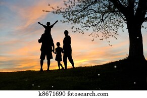 Happy family, father, mother, son and daughter in nature, sunsett Happy family, father, mother, son and daughter in nature, sunsett