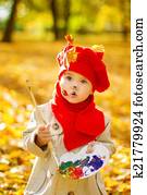 Download Stock Photo of Children playing with autumn fallen leaves ...