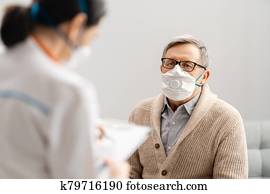 Doctor and senior man wearing facemasks Doctor and senior man wearing facemasks