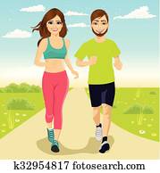 cheerful couple running outdoors
