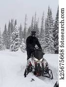 Man Snowmachine, sledding Man Snowmachine, sledding