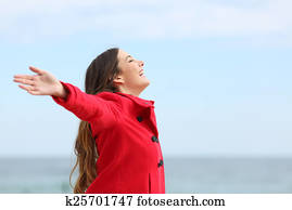 Fashion woman breathing deep fresh air in winter Fashion woman breathing deep fresh air in winter