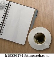 3d cup of coffee in a white cup and blank note book on wooden background as concept