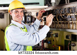 electrician working on industrial machine
