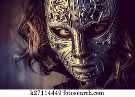 Portrait of a mysterious man in iron mask. Steampunk. Fantasy. Halloween. Portrait of a mysterious man in iron mask. Steampunk. Fantasy. Halloween.