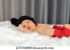 newborn baby in mouse costume on fur bed newborn baby in mouse costume on fur bed