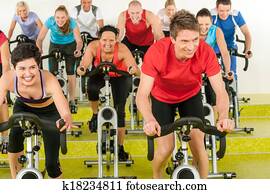 Spinning class sport people exercise at gym Spinning class sport people exercise at gym